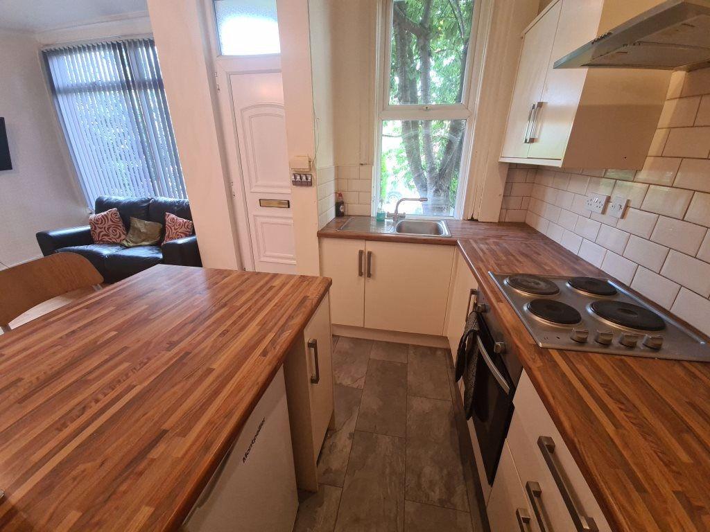 A bright and inviting kitchen with a spacious w...