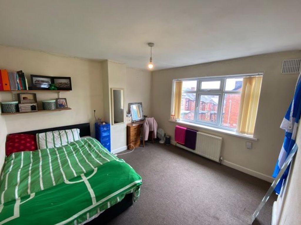 Bright and spacious master bedroom featuring a ...