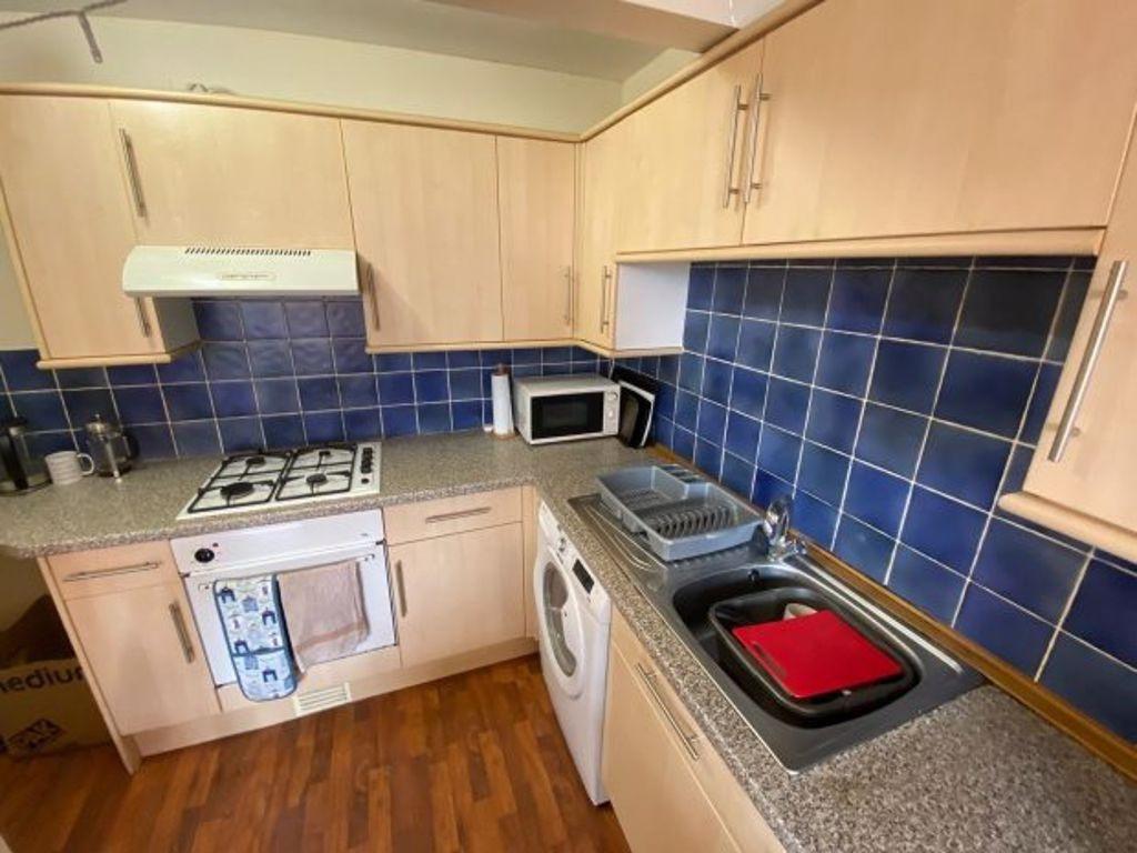 A compact and functional kitchen featuring ampl...