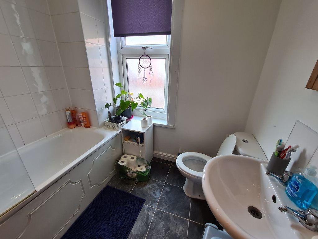 Bright and modern bathroom featuring a clean wh...