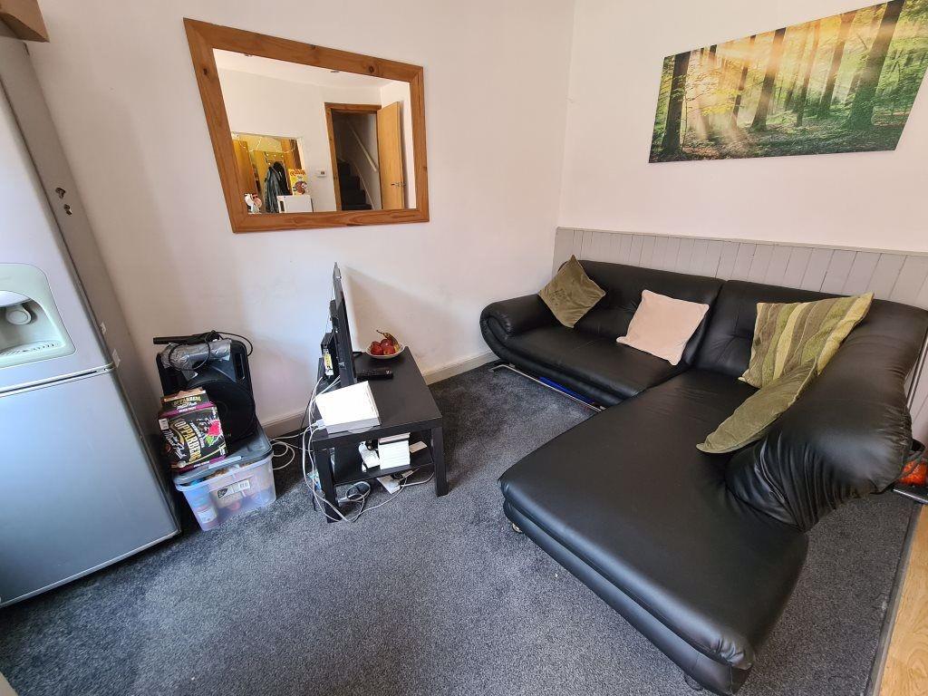 Cozy living room featuring a comfortable L-shap...