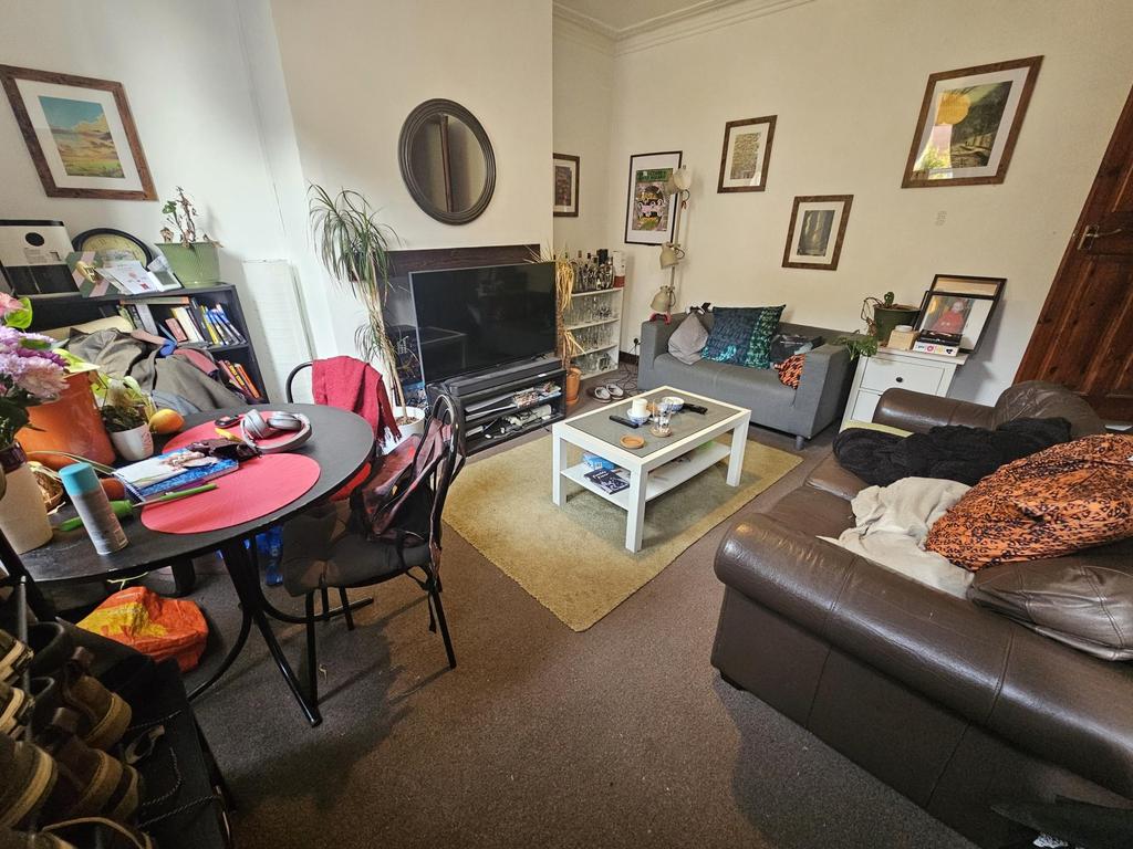 Cozy living room featuring comfortable sofas, a...