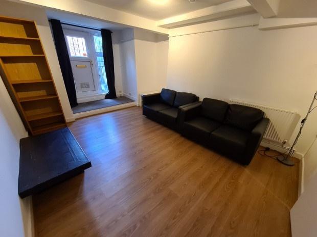 Bright, neatly presented lounge with wood-effec...