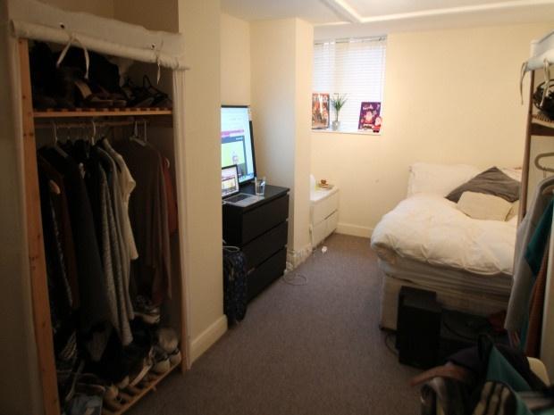 Cozy furnished bedroom with a comfortable bed, ...