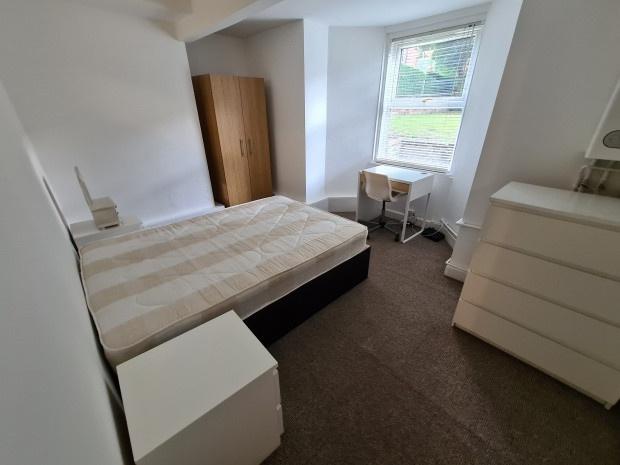 Bright furnished double bedroom with a large wi...