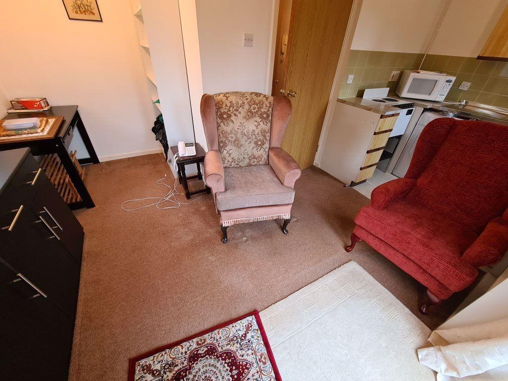 A cozy living room featuring comfortable armcha...