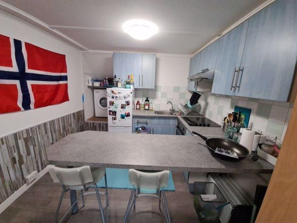 A well-organized kitchen featuring modern appli...