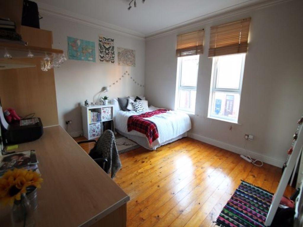 A bright and charming single bedroom with polis...