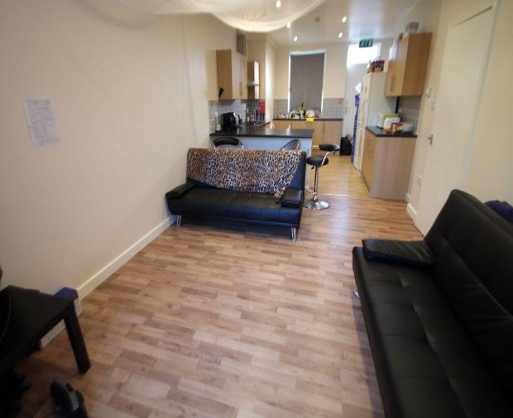 A neat and inviting living room featuring woode...