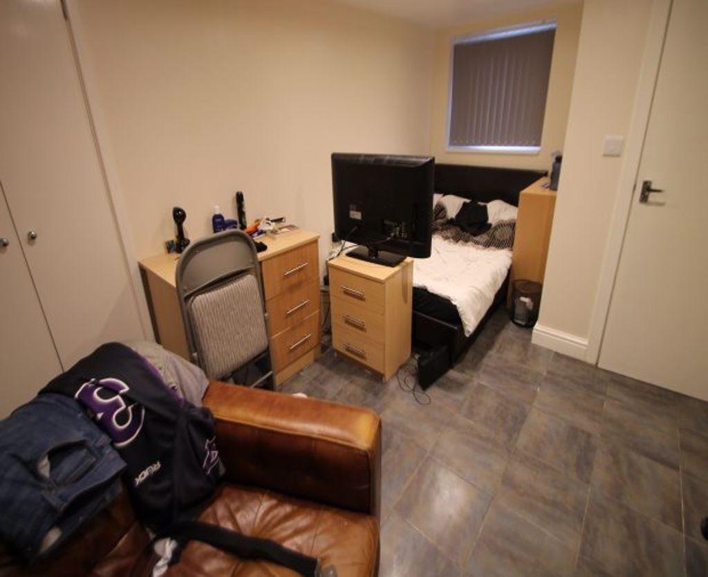 Cozy double bedroom featuring a comfortable dou...