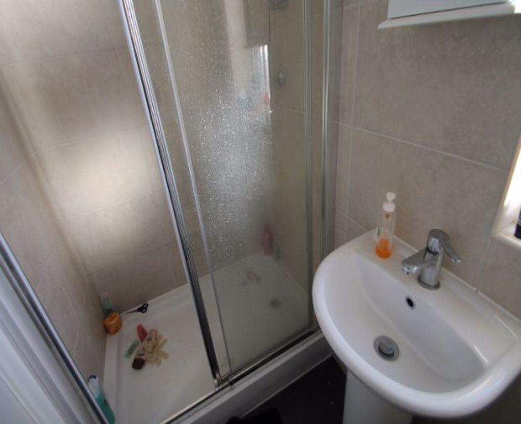 A neat and modern bathroom featuring a compact ...