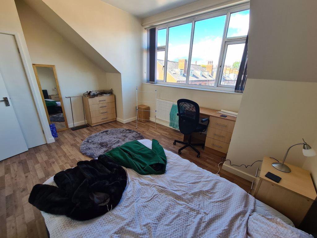 Bright and tidy room with a large window allowi...