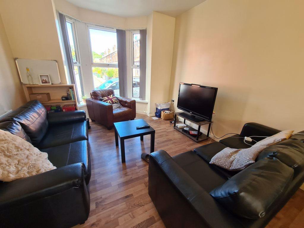 Bright and inviting living room featuring comfo...