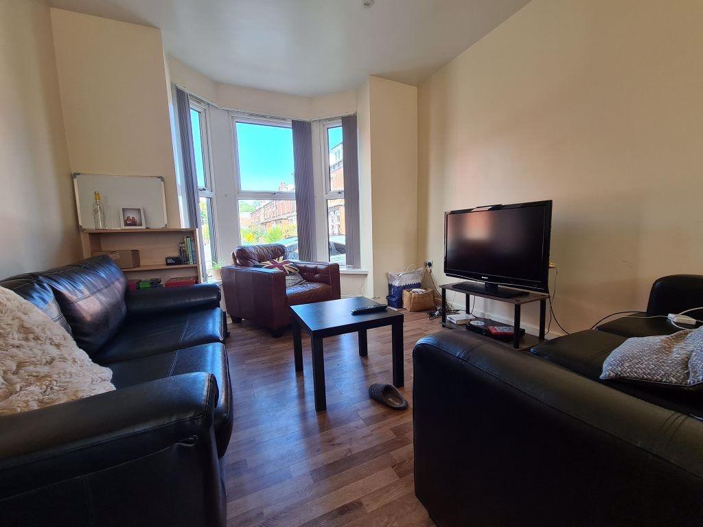 A cozy and inviting living room featuring comfo...