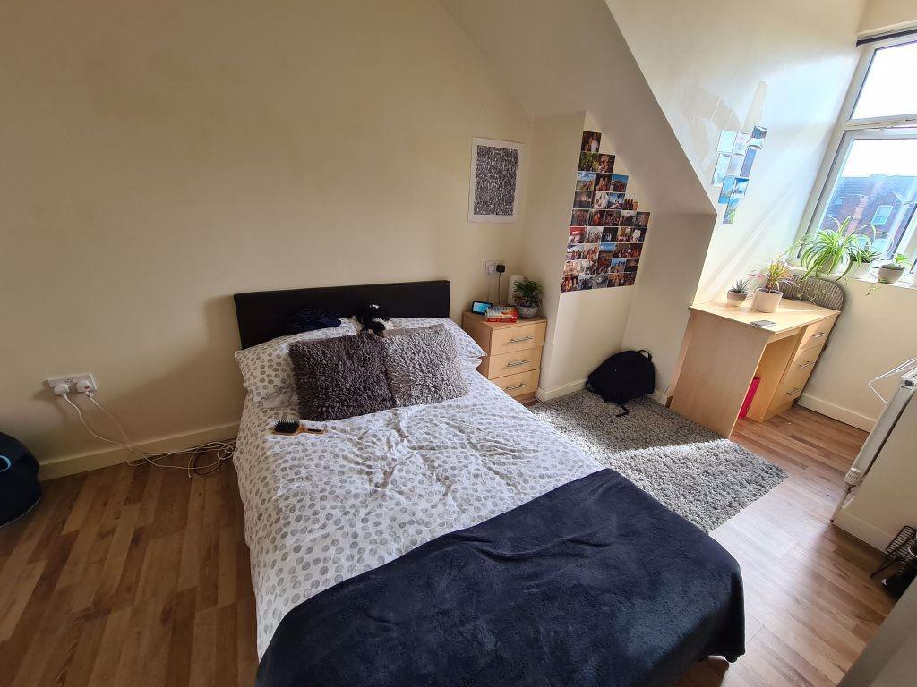 Bright and cozy double bedroom featuring a comf...