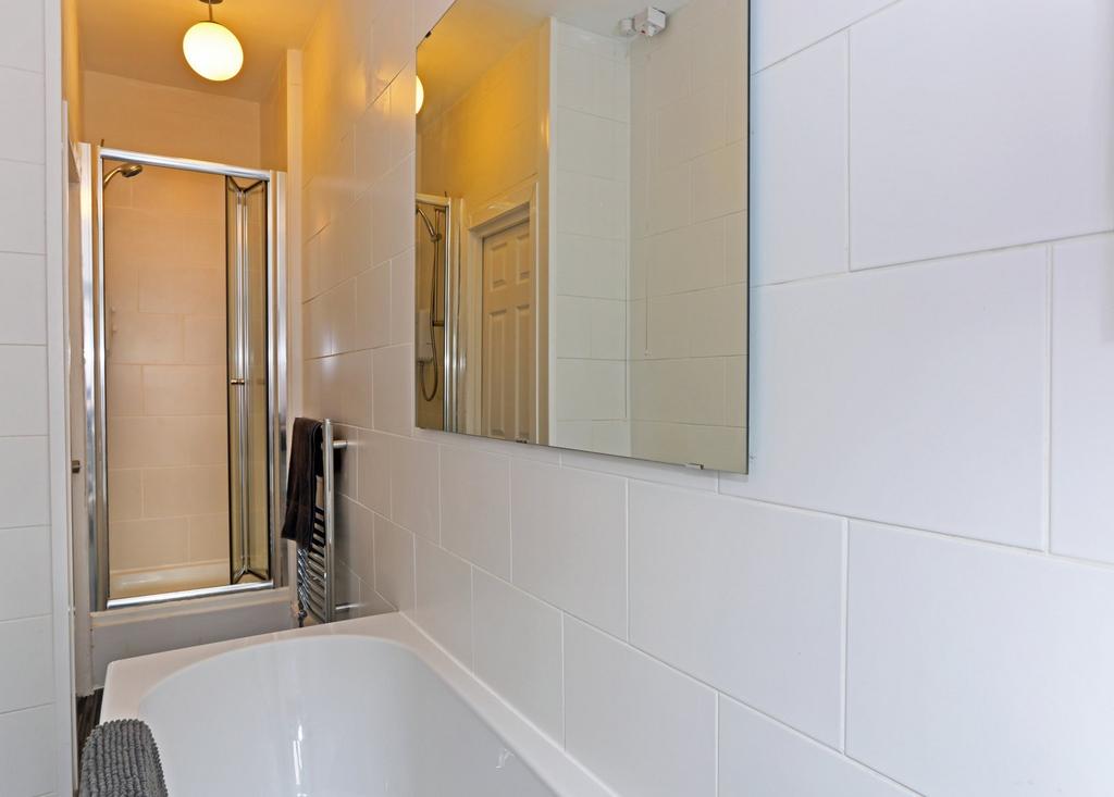 A clean and modern bathroom featuring a white b...
