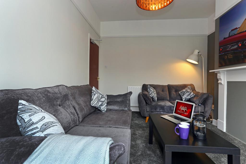 A cozy and modern living room featuring plush g...