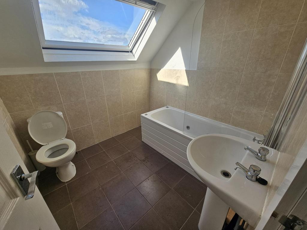 Bright and clean bathroom featuring a modern wh...