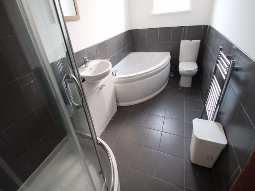 A modern bathroom suite featuring a spacious co...