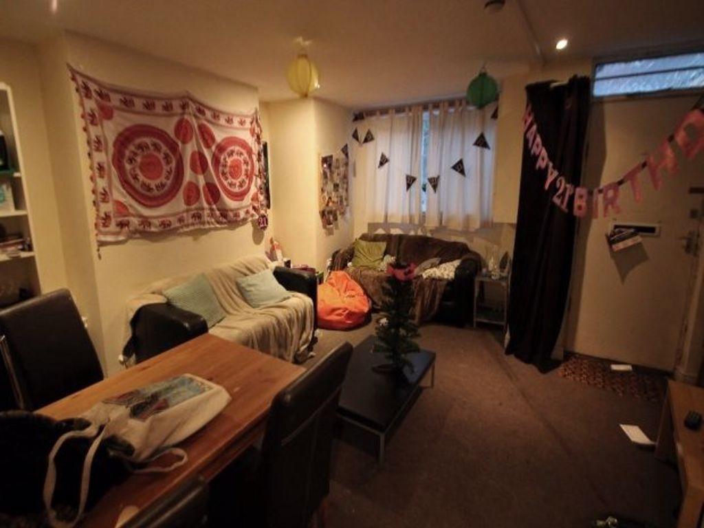 Cozy living room with comfortable seating, a de...