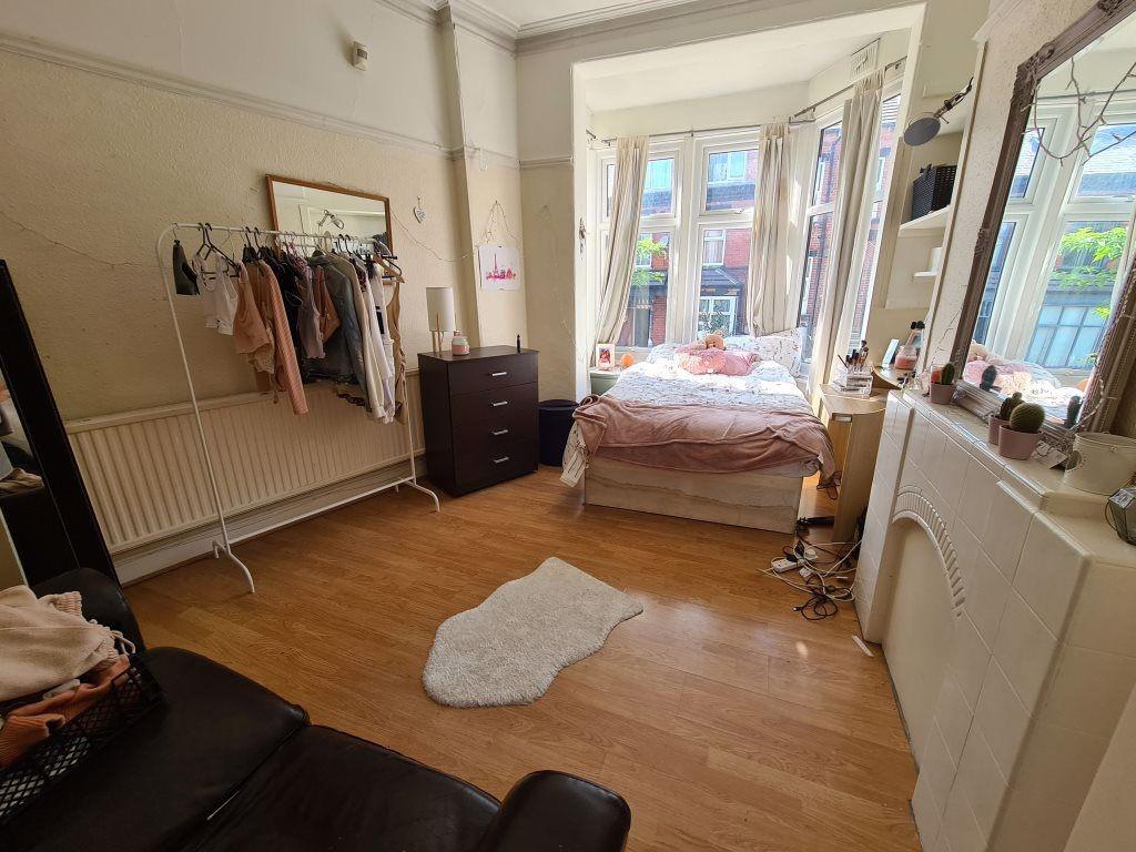 Bright and spacious master bedroom featuring a ...