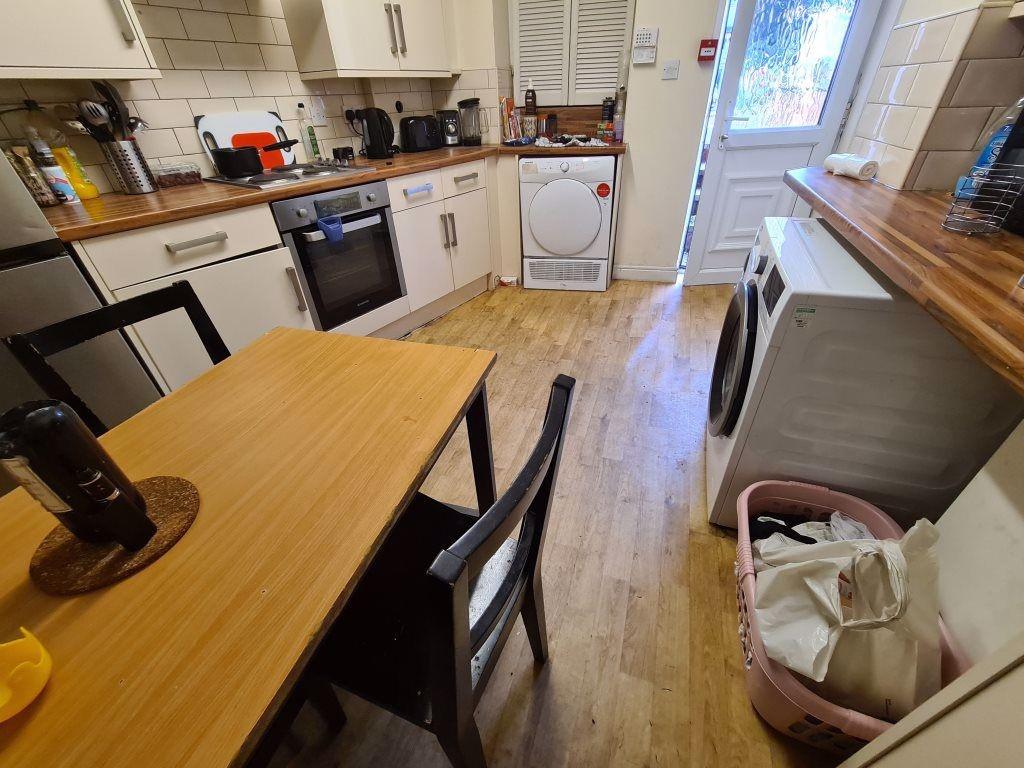 A bright and functional kitchen featuring woode...