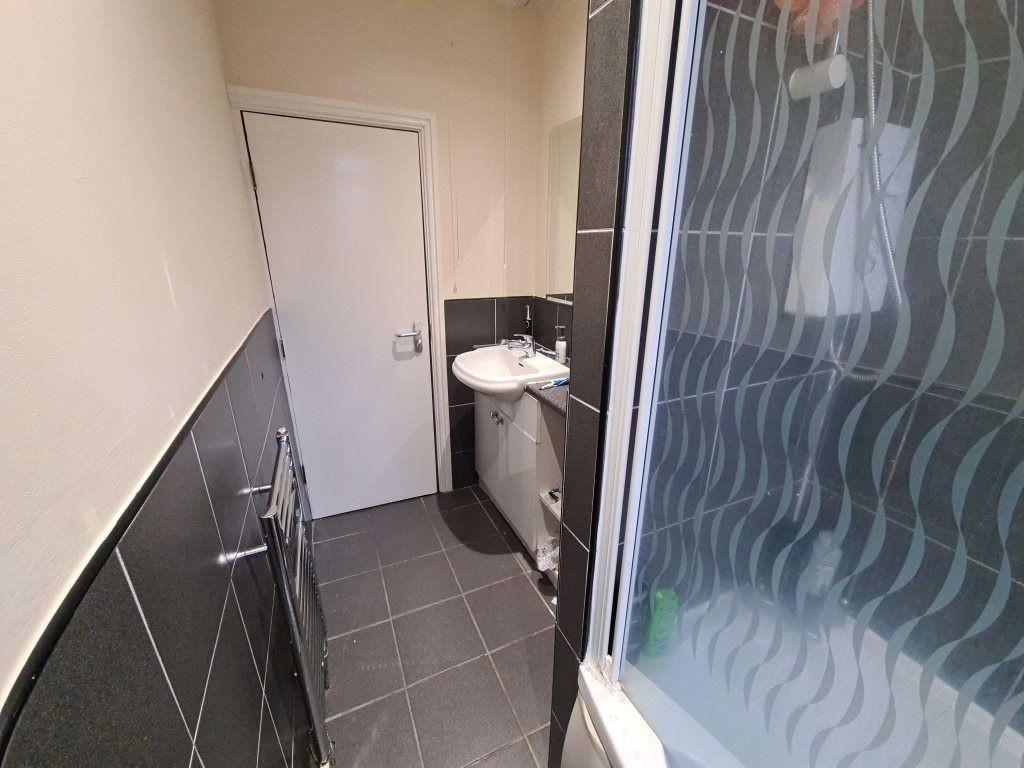 A neat and modern bathroom featuring a clean si...