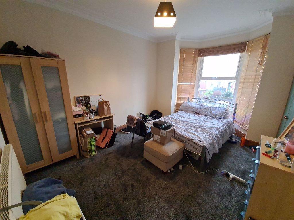 A cozy double bedroom featuring a comfortable d...