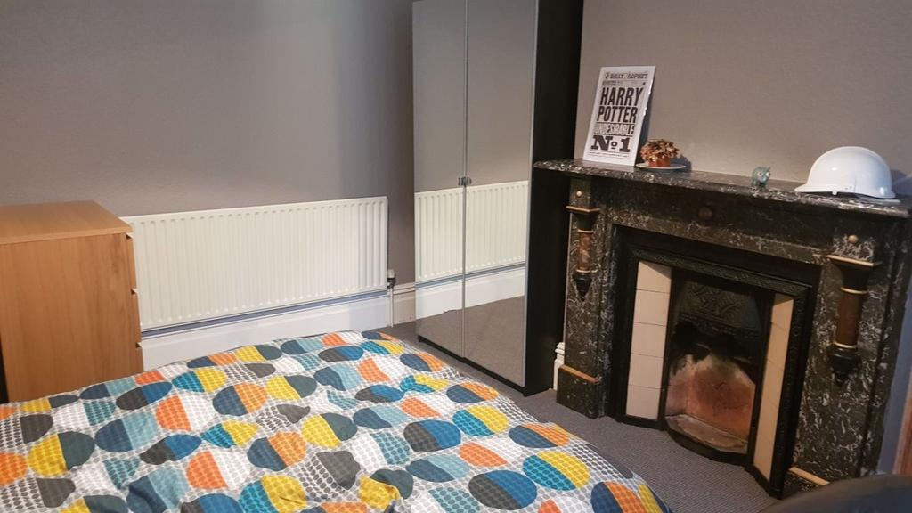 A cozy and inviting master bedroom featuring a ...