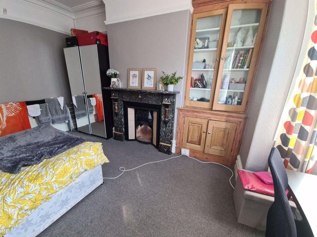 A cozy and inviting master bedroom featuring a ...
