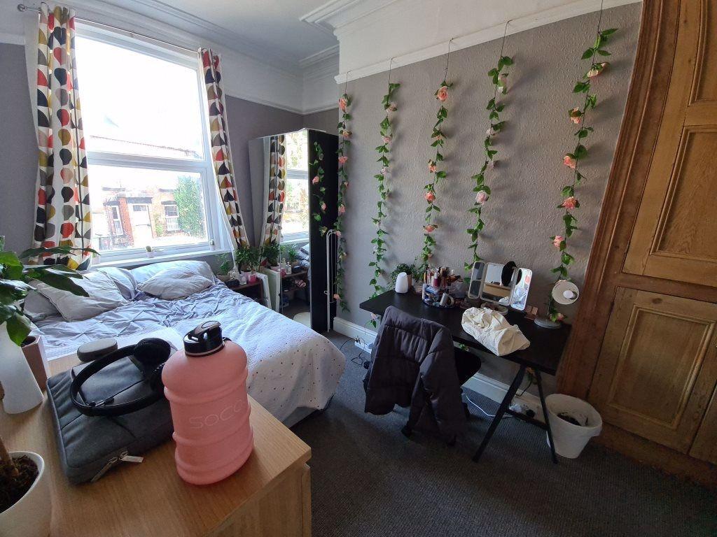 Bright and cozy double bedroom featuring a larg...