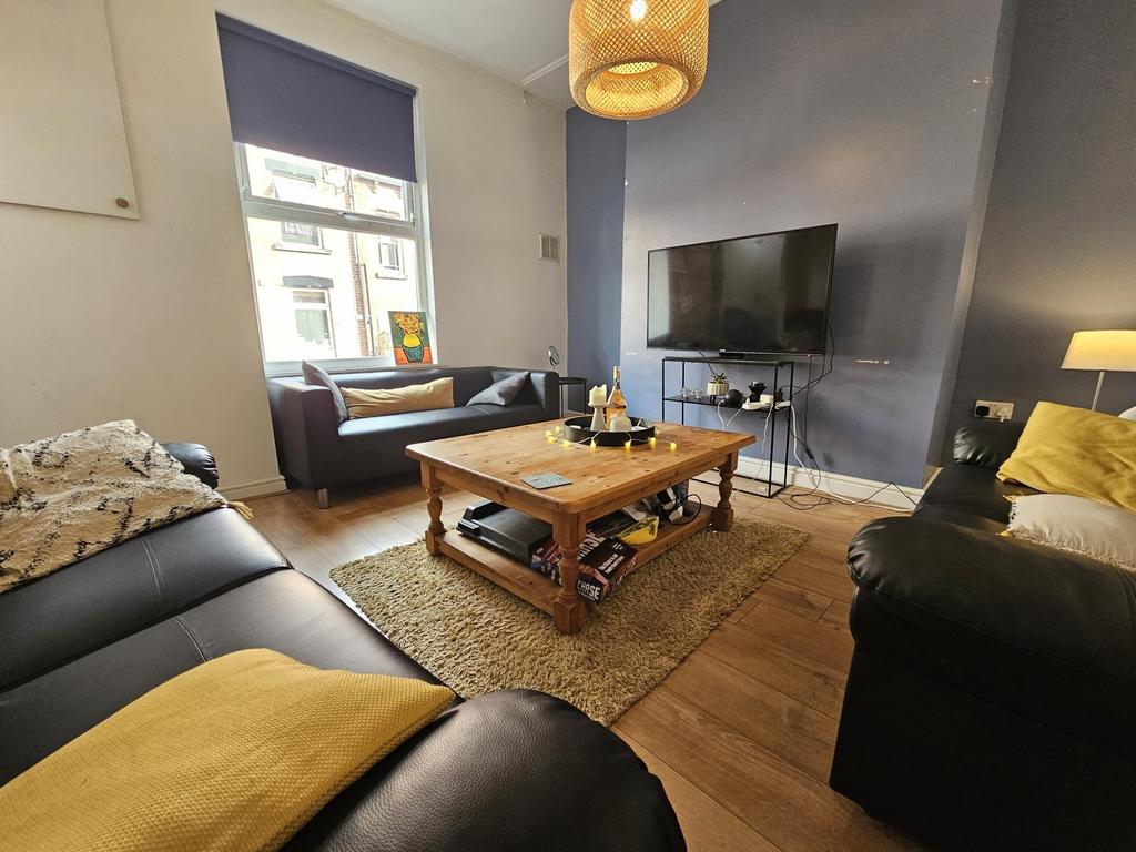 A cozy and stylish living room featuring comfor...