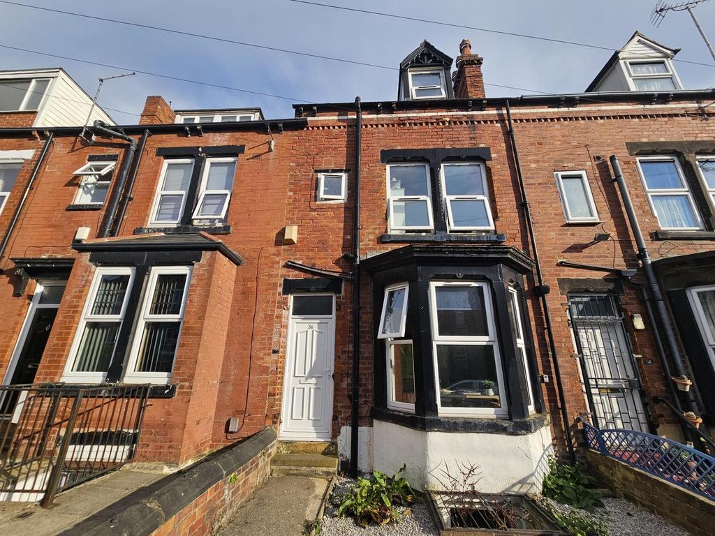 Traditional red-brick terraced house with class...