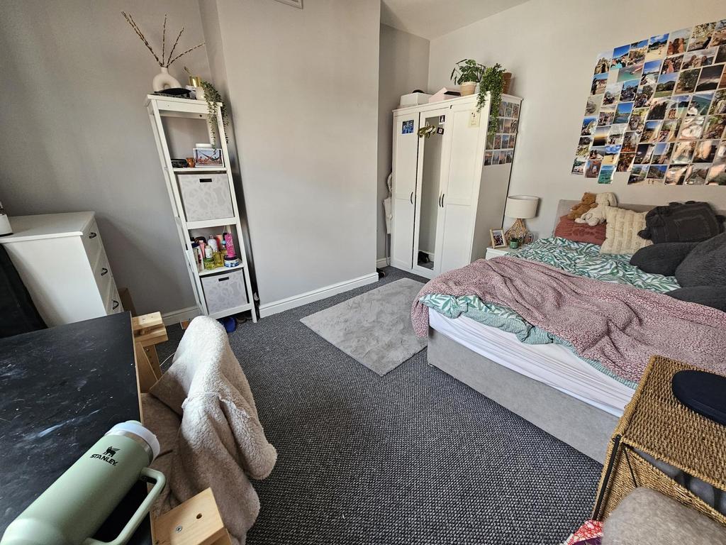 Bright and cozy double bedroom featuring a comf...