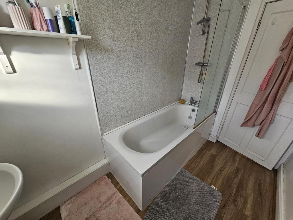 A neat and well-maintained bathroom featuring a...