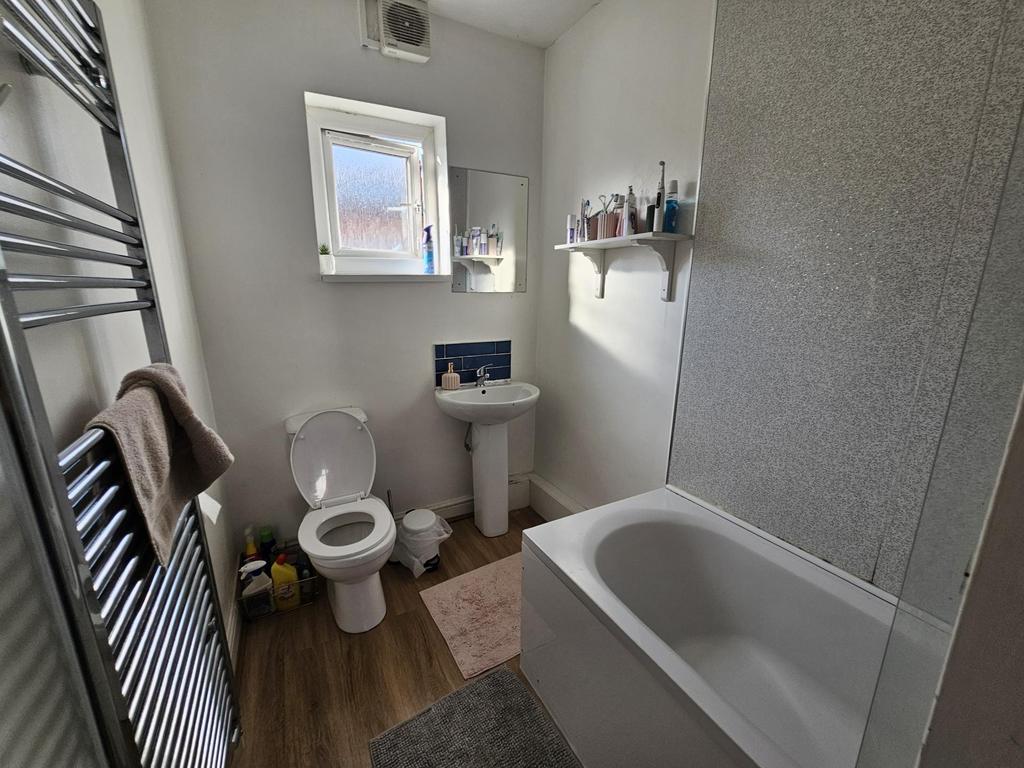A bright and well-maintained bathroom featuring...