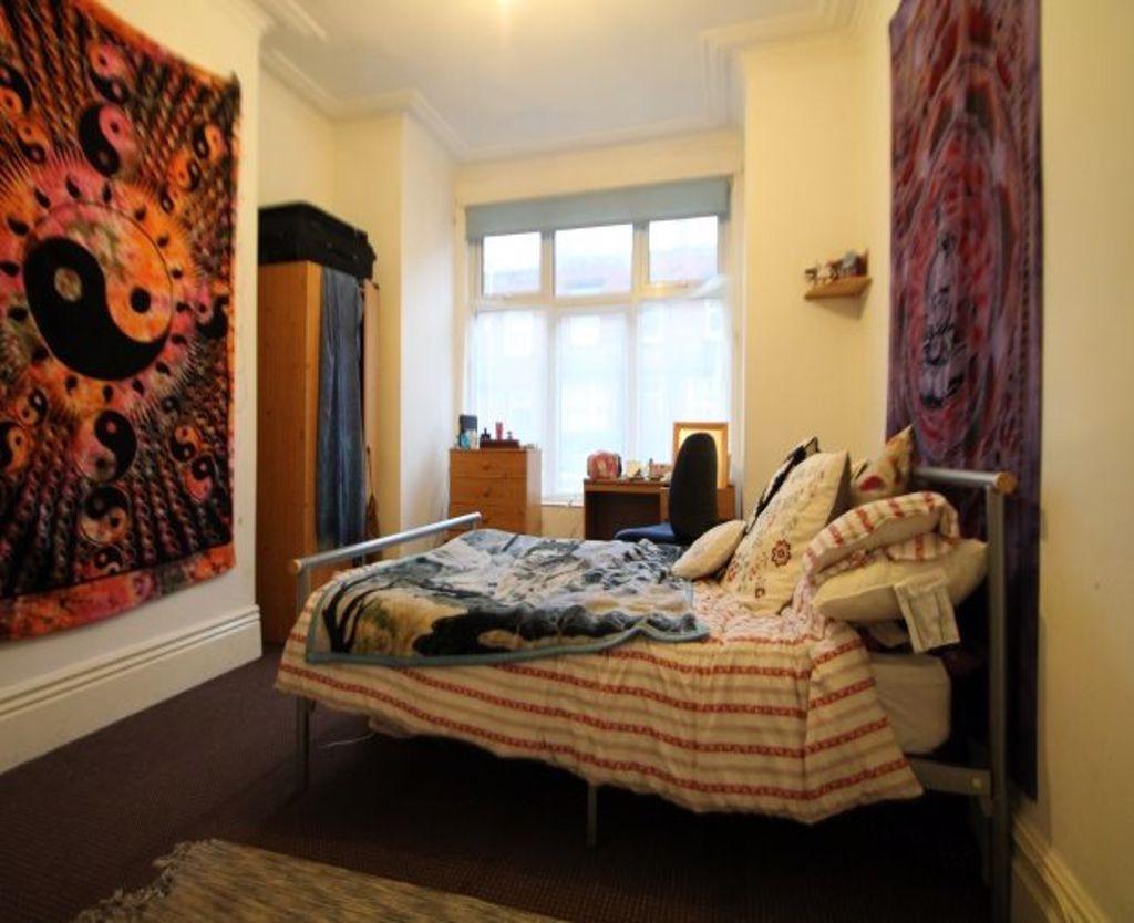 Cozy double bedroom featuring a comfortable dou...