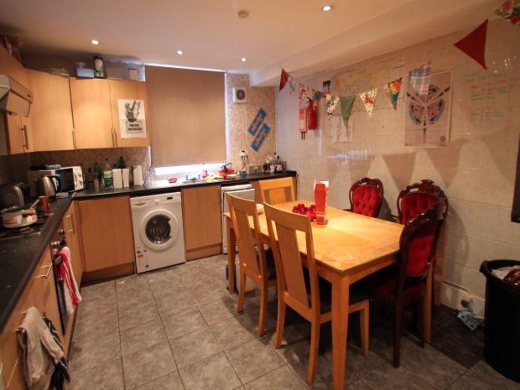 A warm and inviting kitchen featuring a wooden ...