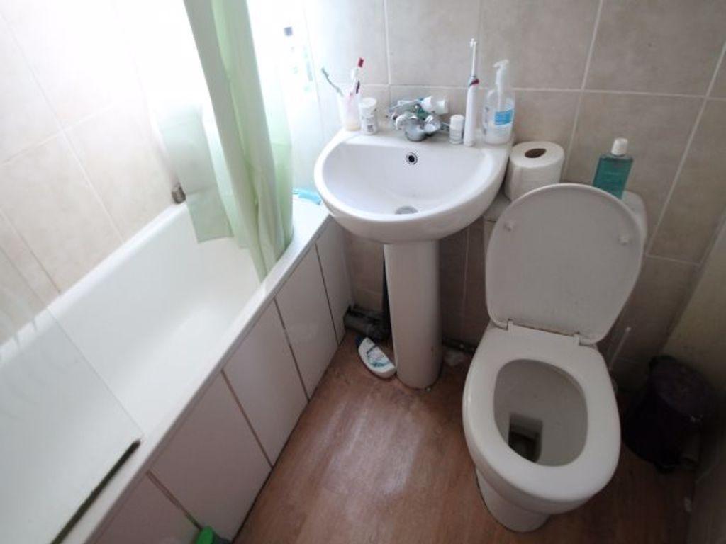 A clean and modern bathroom featuring a white s...
