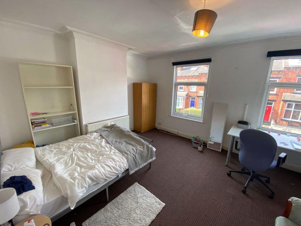 A cozy double bedroom featuring a comfortable d...