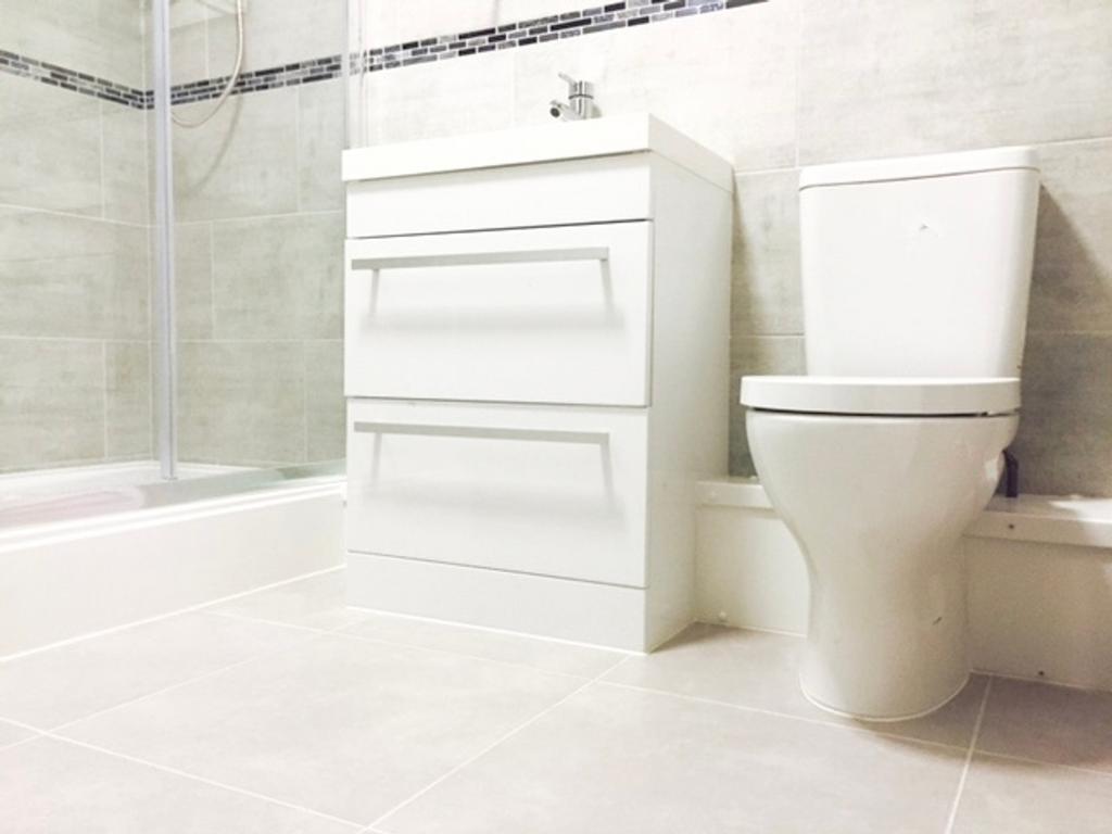 A modern bathroom featuring sleek, clean lines ...
