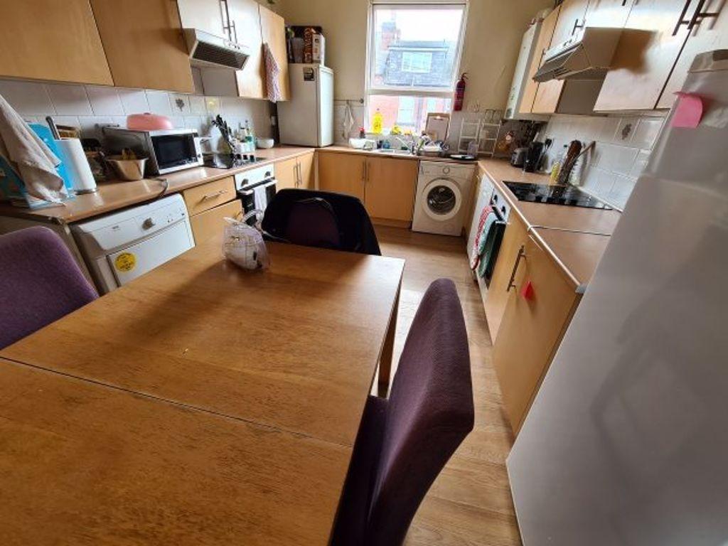 Bright and functional kitchen featuring ample w...