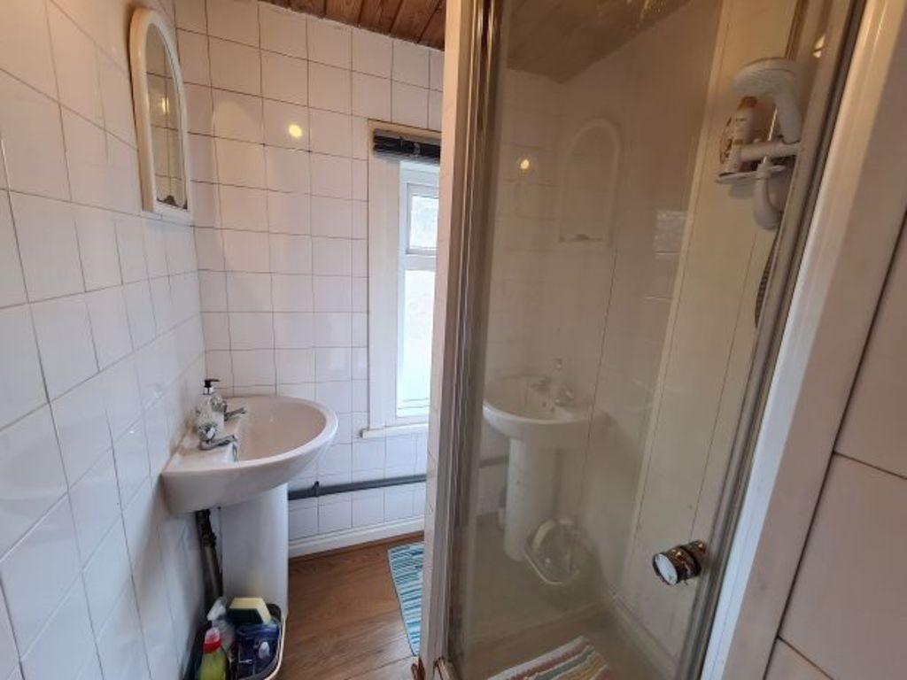 Bright and clean bathroom featuring a spacious ...
