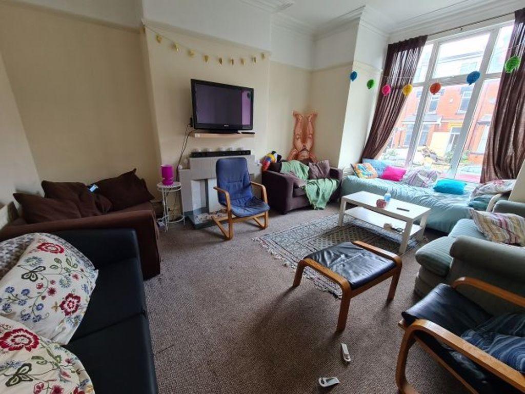 A cozy living room with ample seating including...