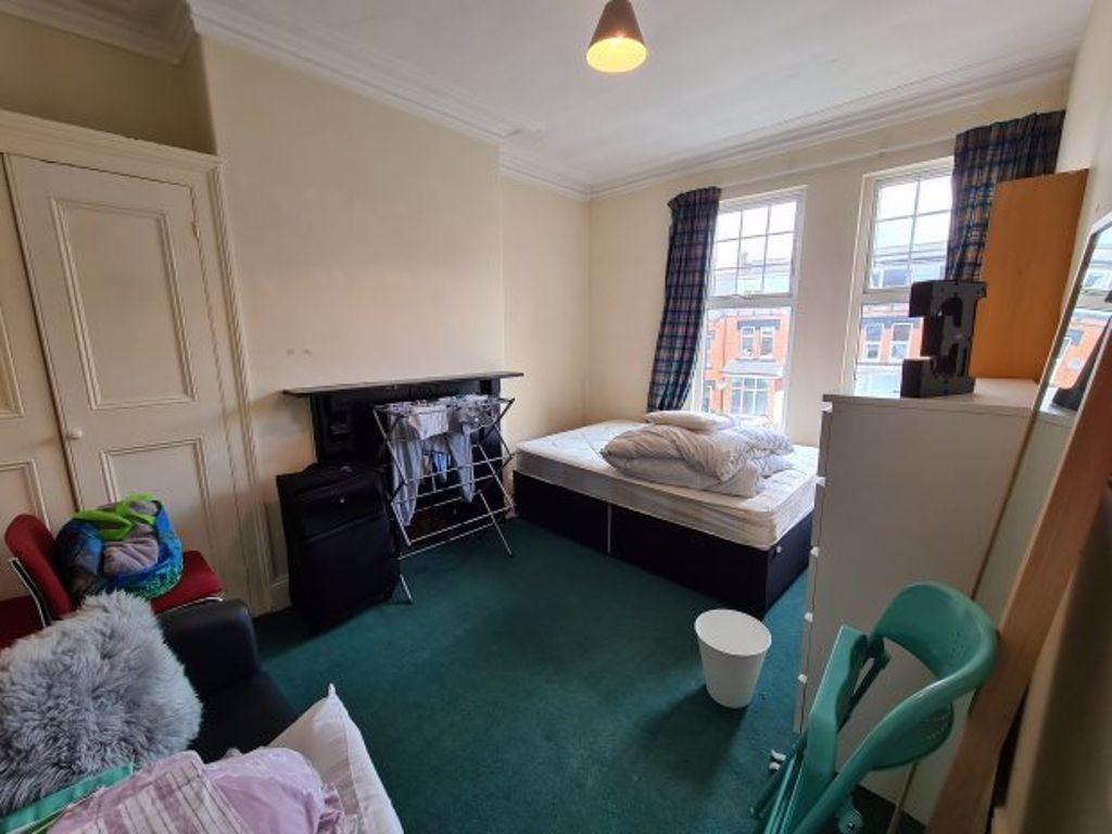 A cozy double bedroom featuring a comfortable d...