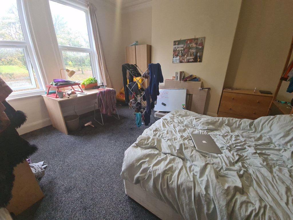 A cozy double bedroom featuring a comfortable d...