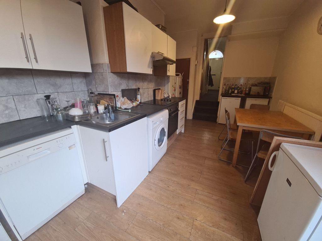 Bright and functional kitchen with clean counte...