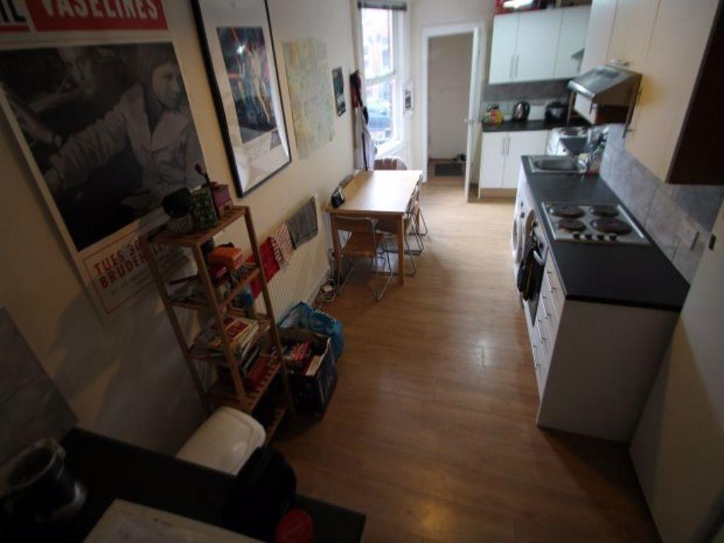 A neat and functional kitchen space featuring a...