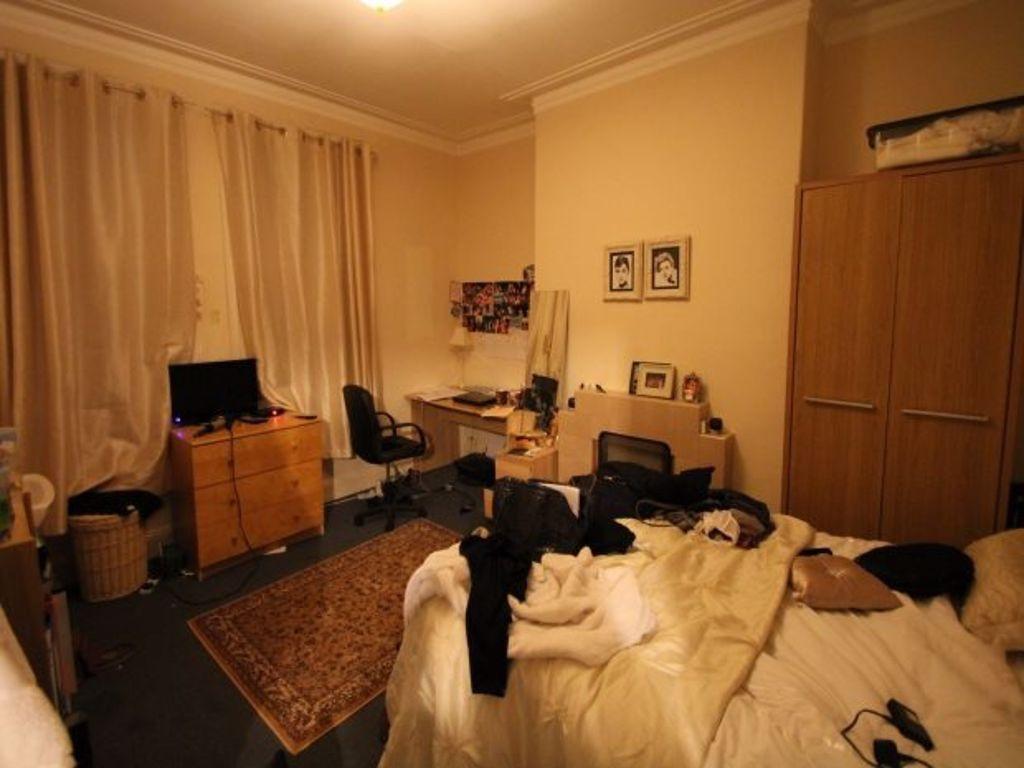 Cozy master bedroom featuring a double bed, amp...