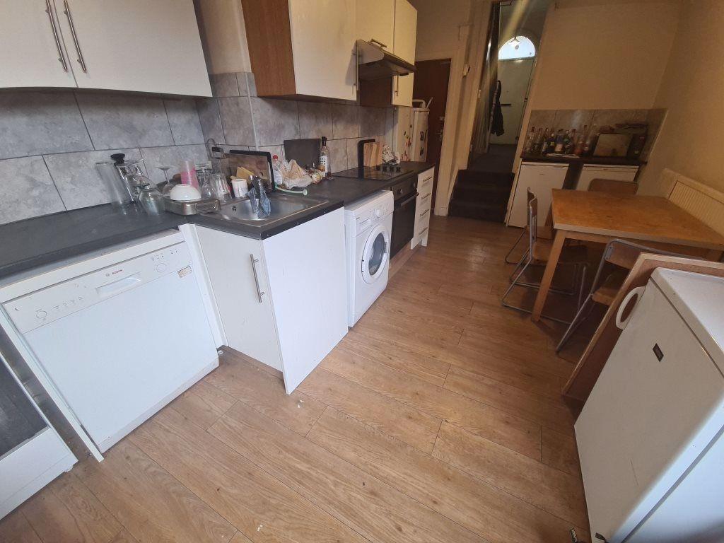 A clean and functional kitchen space with moder...